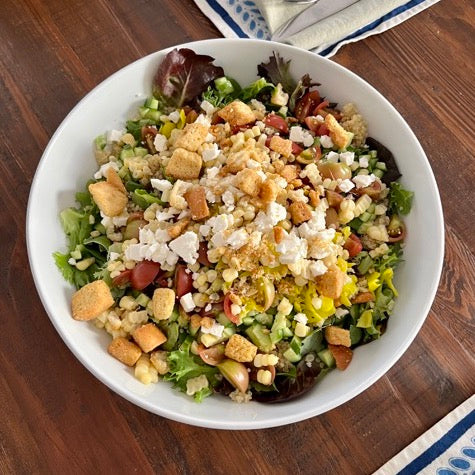 image of a salad in a white bowl